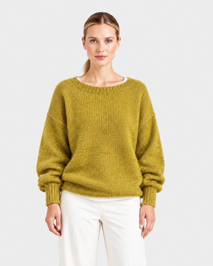 Luna Moda Elda crew neck sweater in olive green with a soft, relaxed fit and ribbed cuffs worn by a model.