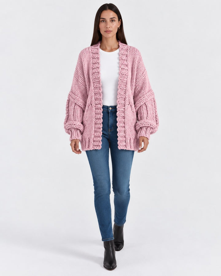 Luna Moda Ginevra oversized pink chunky knit cardigan worn by a model with blue jeans and black boots