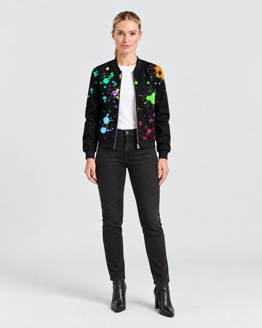 Luna Moda Sofia bomber jacket in black with a vibrant multi-colored paint splatter botanical print on a model.