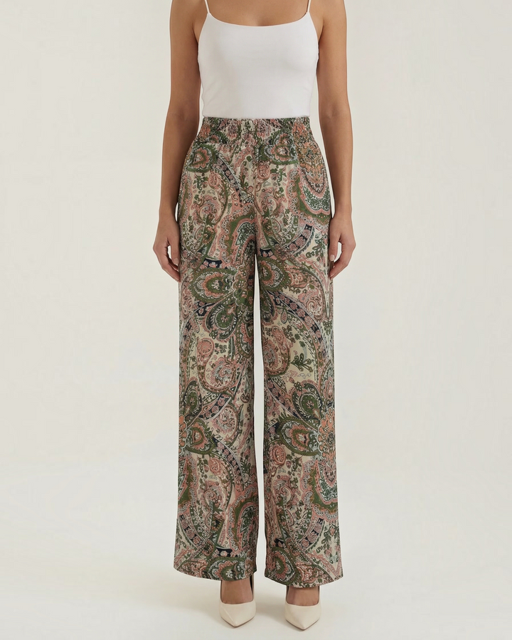 Luna Moda Melania wide-leg trousers featuring a vibrant bohemian paisley print in soft green and pink tones.