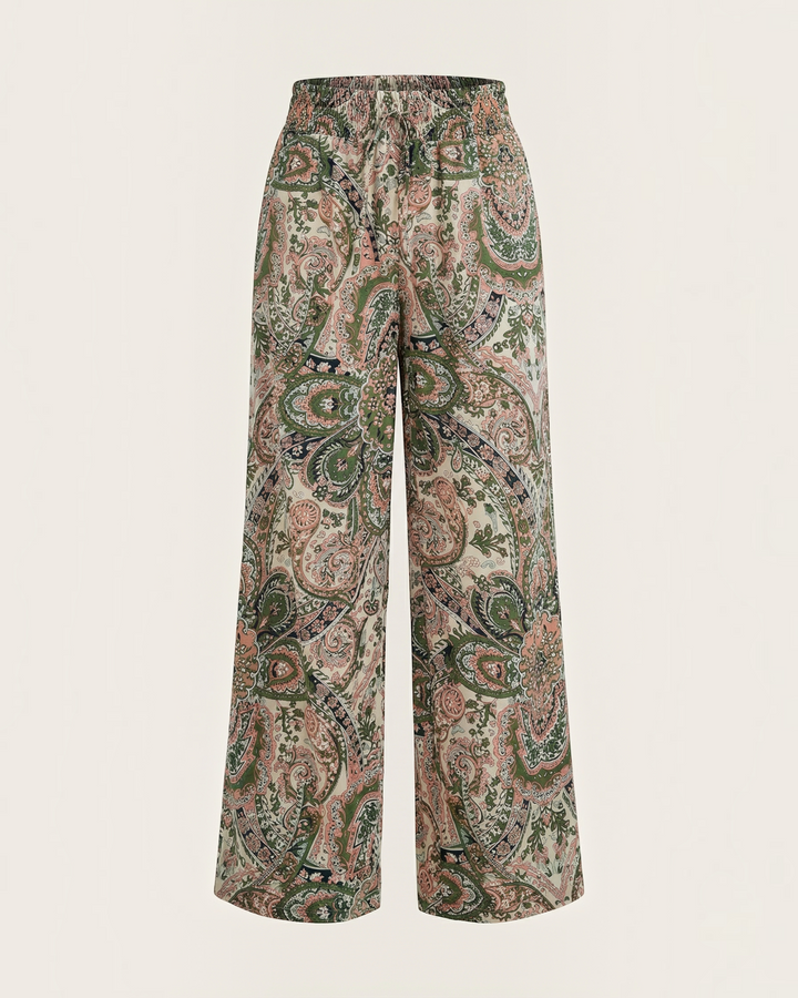 Luna Moda Melania wide-leg trousers featuring a vibrant bohemian paisley print in soft green and pink tones.