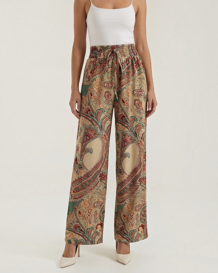 Luna Moda Melania wide-leg trousers featuring a vibrant multicolor paisley print in a soft, flowing fabric.