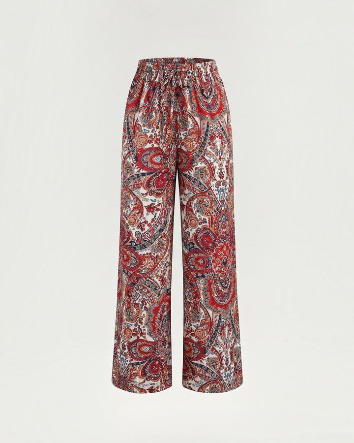 Luna Moda Melania wide-leg trousers featuring a vibrant multicolored paisley print in lightweight flowing fabric
