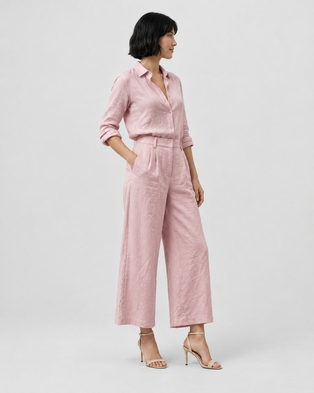 Luna Moda pink casual chic two-piece set with a loose button-down shirt and wide-leg capri trousers on a model.