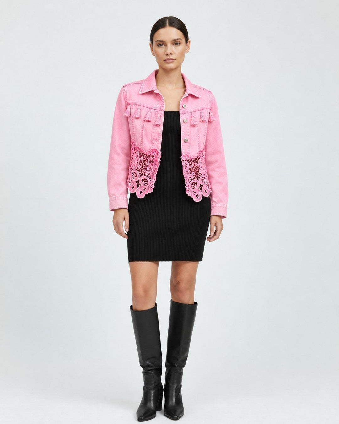 Luna Moda pink denim jacket featuring chest fringe details and a delicate lace hem, worn over a black dress.