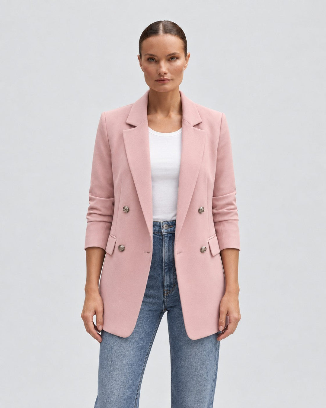 Luna Moda pink double-breasted blazer for women with notched lapels and silver buttons worn over a white top