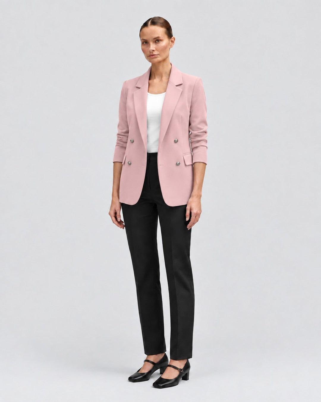 Luna Moda pink double-breasted blazer worn by a model with black trousers and heels for a sophisticated look