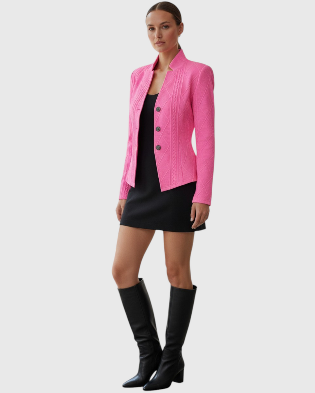 Luna Moda bright pink textured mid-season coat worn by a model over a black dress with tall leather boots
