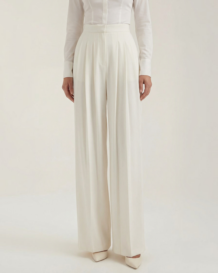 Luna Moda ivory crepe palazzo trousers with meticulous pleats and a high-waisted tailored fit on a model
