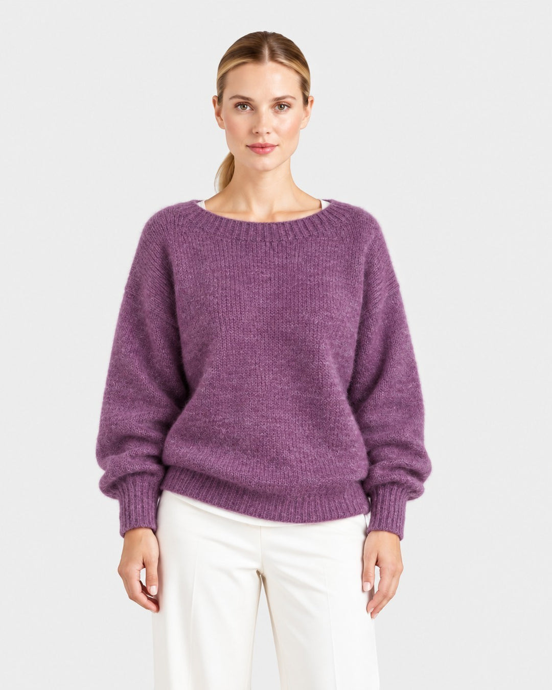 Luna Moda Elda purple crew neck sweater with a soft, relaxed fit and ribbed cuffs worn by a woman.