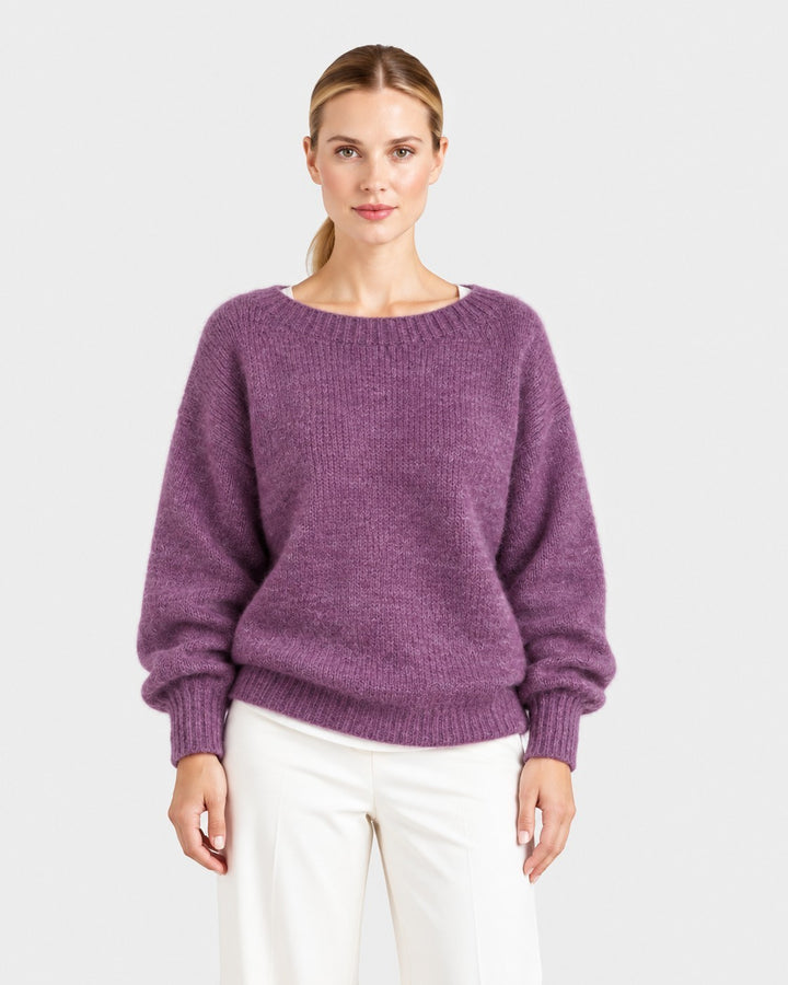 Luna Moda Elda purple crew neck sweater with a soft, relaxed fit and ribbed cuffs worn by a woman.