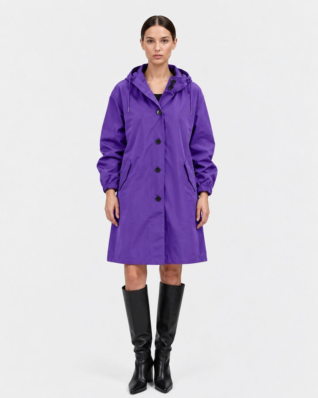 Luna Moda purple oversized waterproof raincoat with hood, button front, and pockets worn by a model