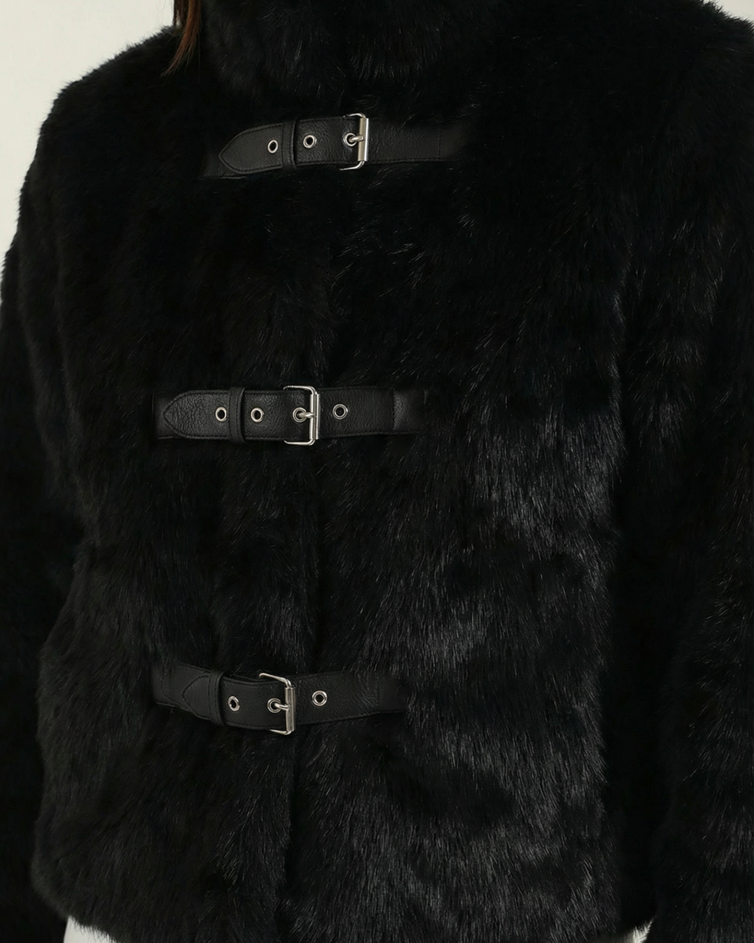 Luna Moda black faux fur cropped jacket with three leather buckle closures and a high collar