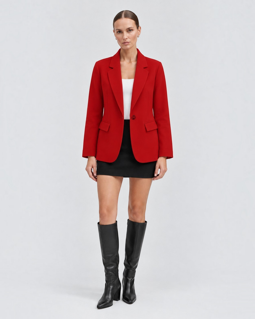 Luna Moda red classic blazer worn by a model with a white top, black mini skirt, and black knee-high boots.