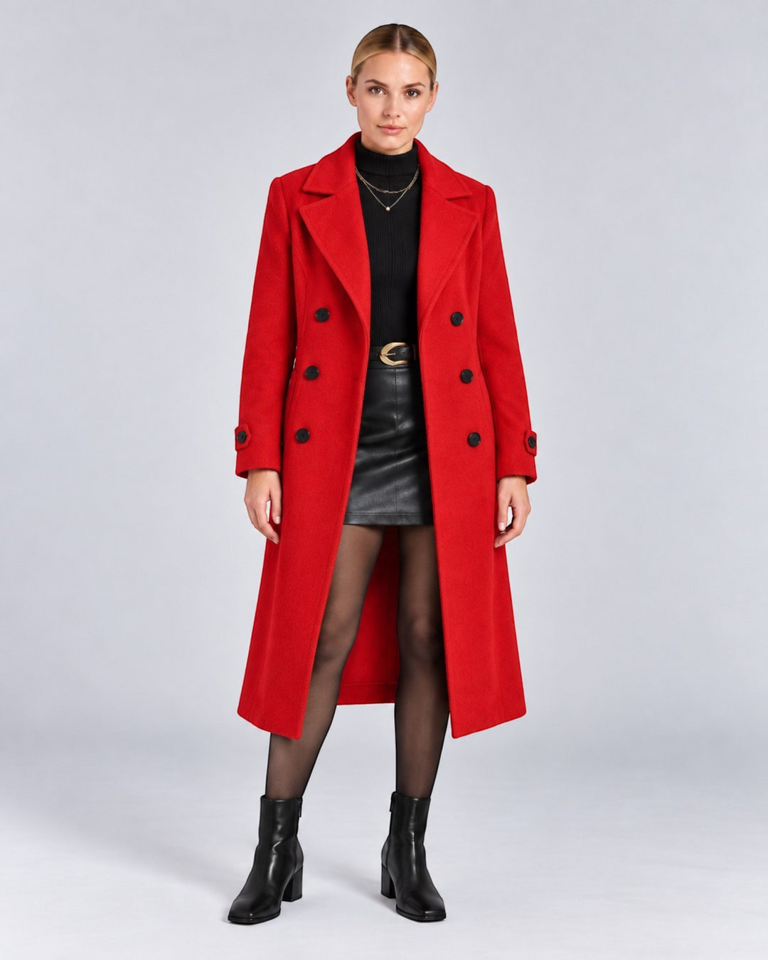 Luna Moda red double-breasted long wool coat worn by a model with a black turtleneck and leather skirt