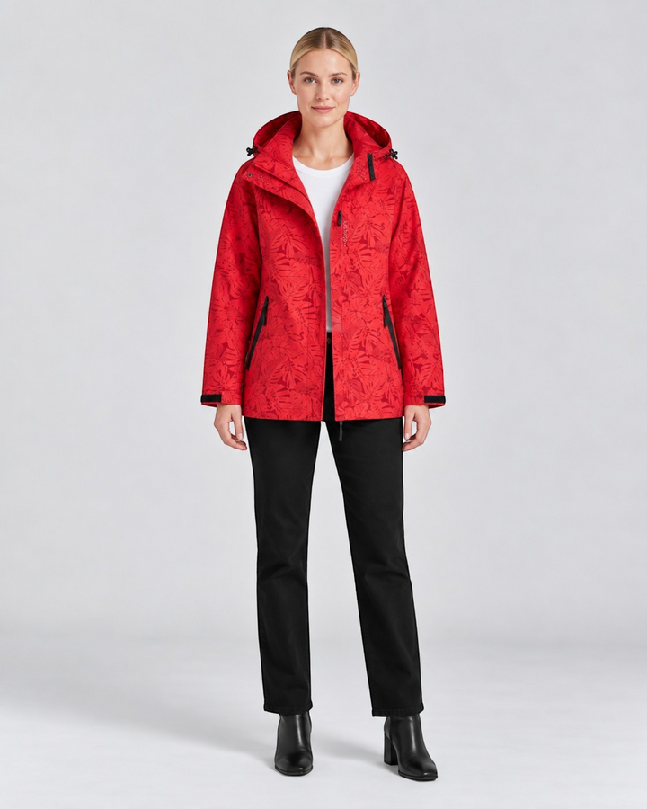 Luna Moda red waterproof hooded jacket with a floral pattern worn by a model with black trousers and boots