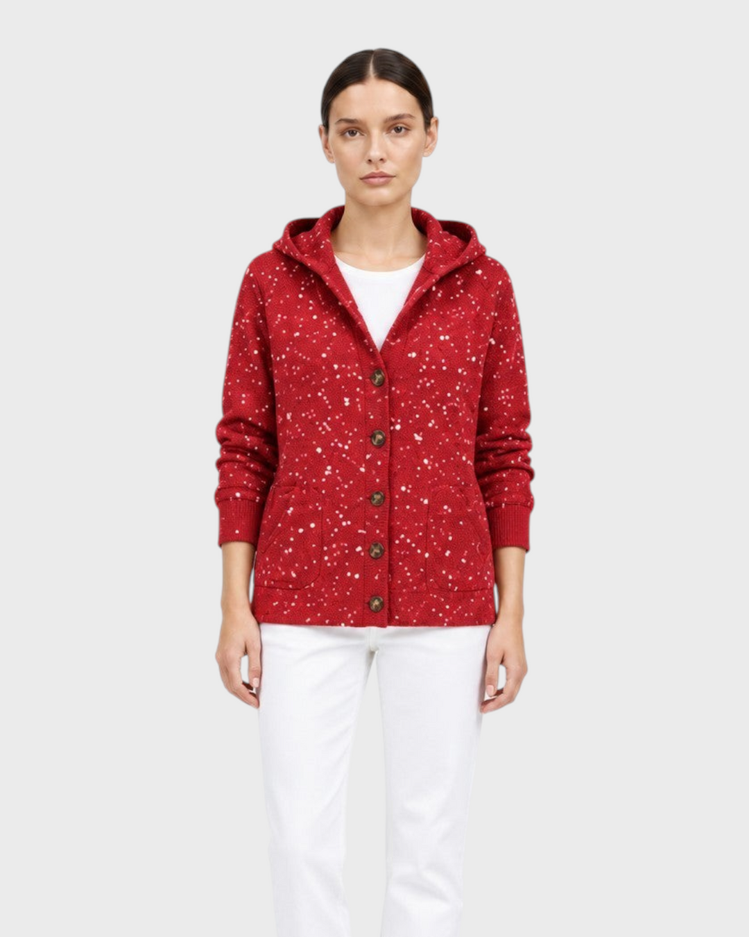 Luna Moda red speckled knit cardigan with a hood, button-up front, and pockets worn over white trousers.