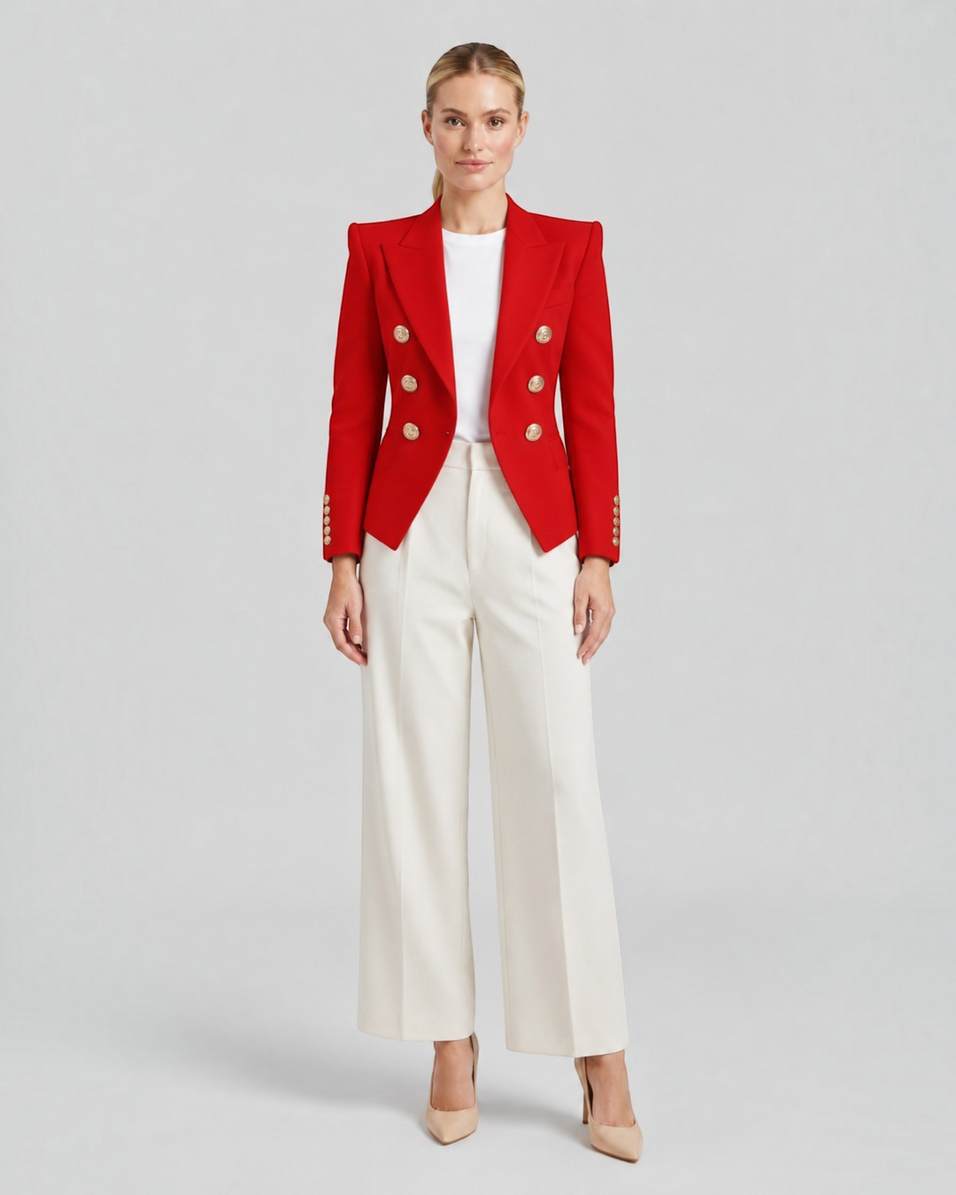 Luna Moda red structured blazer with gold decorative buttons worn by a model with white trousers and heels