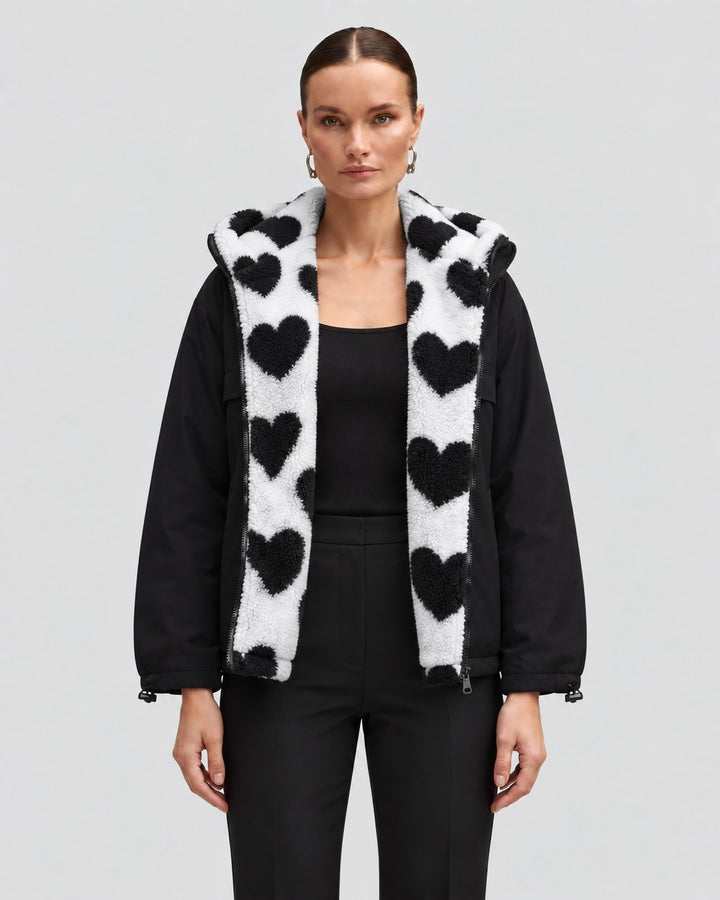 Luna Moda reversible short jacket in black with a white faux fur lining featuring a black heart pattern