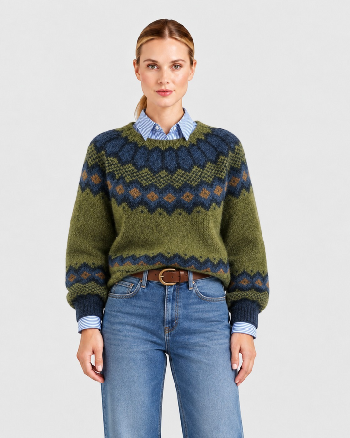 Luna Moda Romina relaxed fit sweater with olive, navy, and amber Fair Isle pattern, worn over a blue striped shirt.