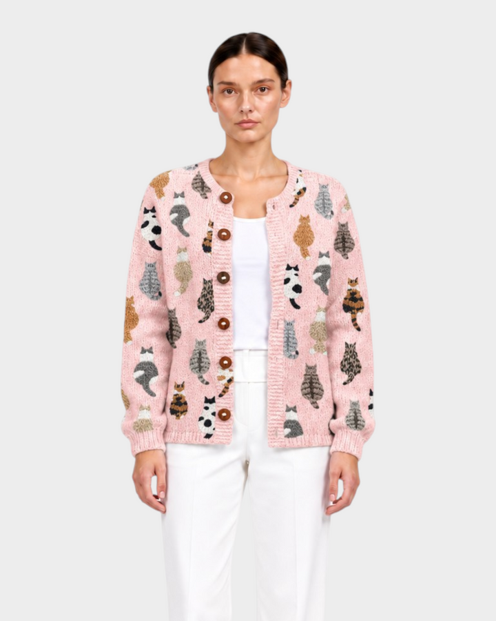 Luna Moda Sofia pink knit cardigan featuring a playful all-over cat print, button-front closure, and long sleeves.