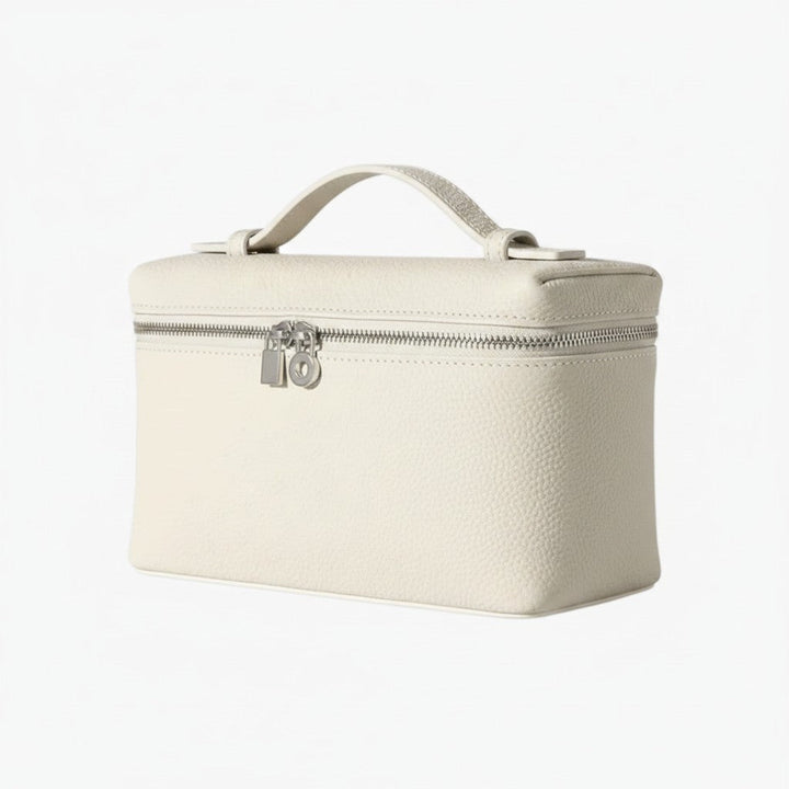 Luna Moda structured cream handbag with a top handle, silver zip closure, and minimalist design.