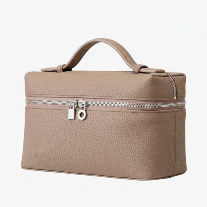 Luna Moda structured taupe leather vanity bag with silver metal hardware, top handle, and secure zip closure.