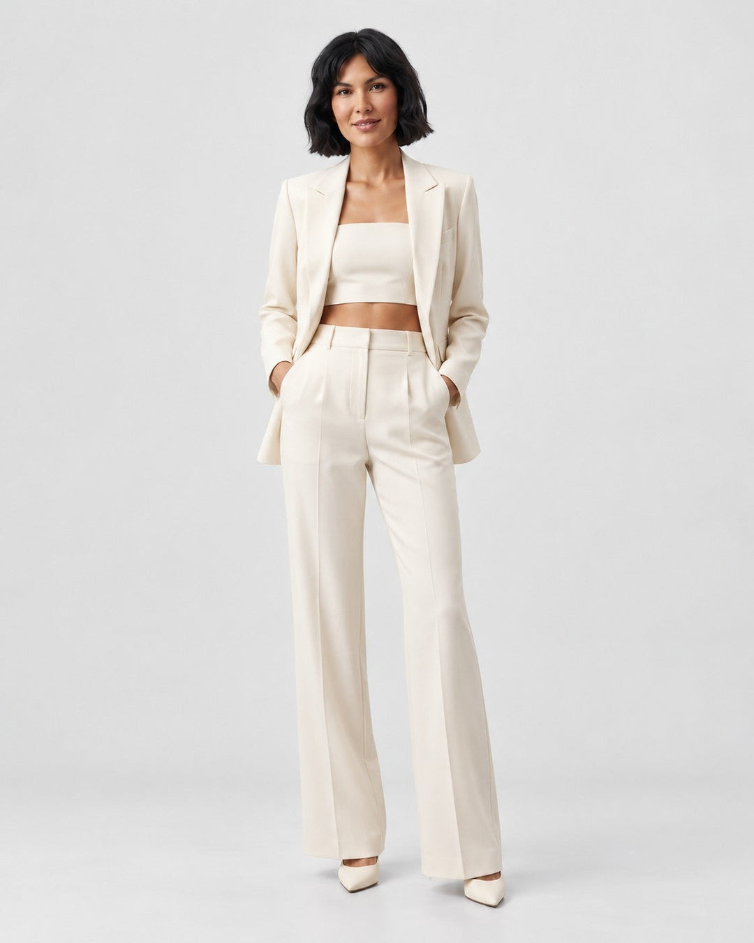 Luna Moda Tamara three-piece tailored suit in cream featuring a blazer, crop top, and wide-leg trousers on a model.
