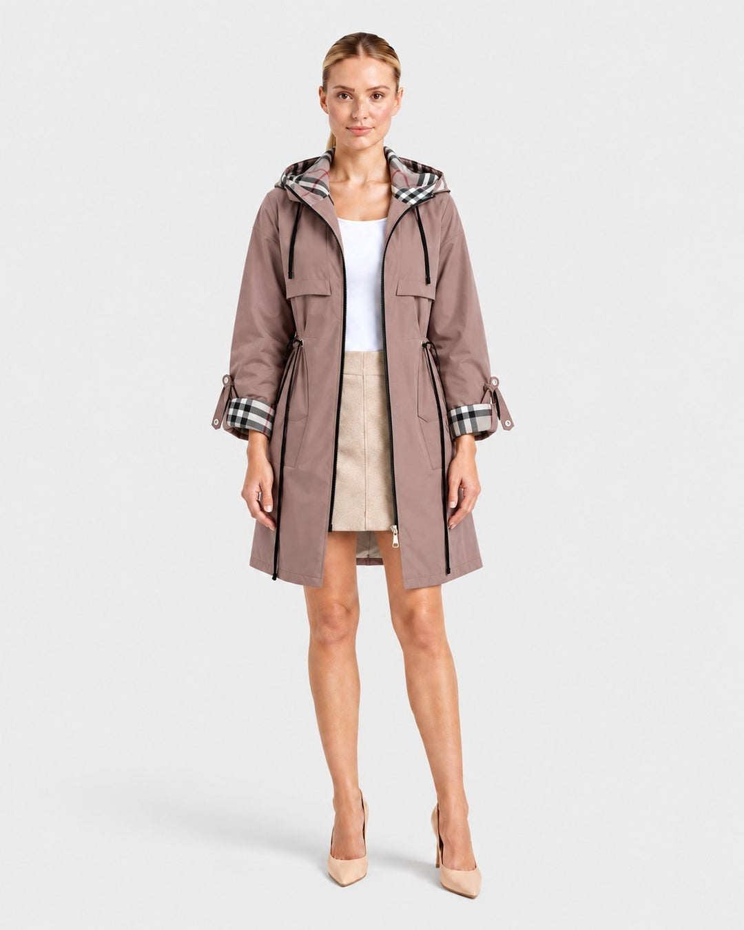 Model wearing a Luna Moda lightweight taupe windbreaker jacket with a plaid hood lining and adjustable waist.