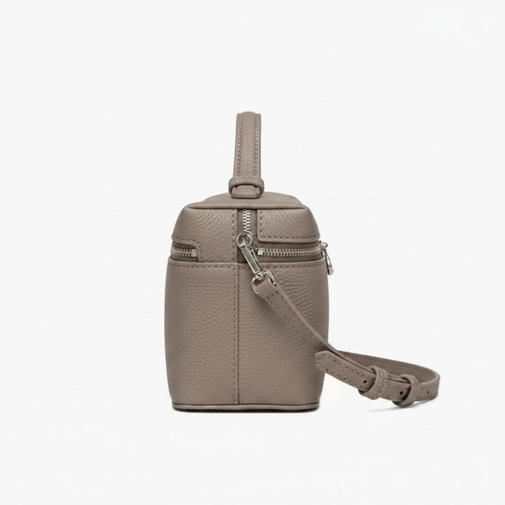 Luna Moda structured taupe leather handbag with silver hardware, top handle, and adjustable shoulder strap side view