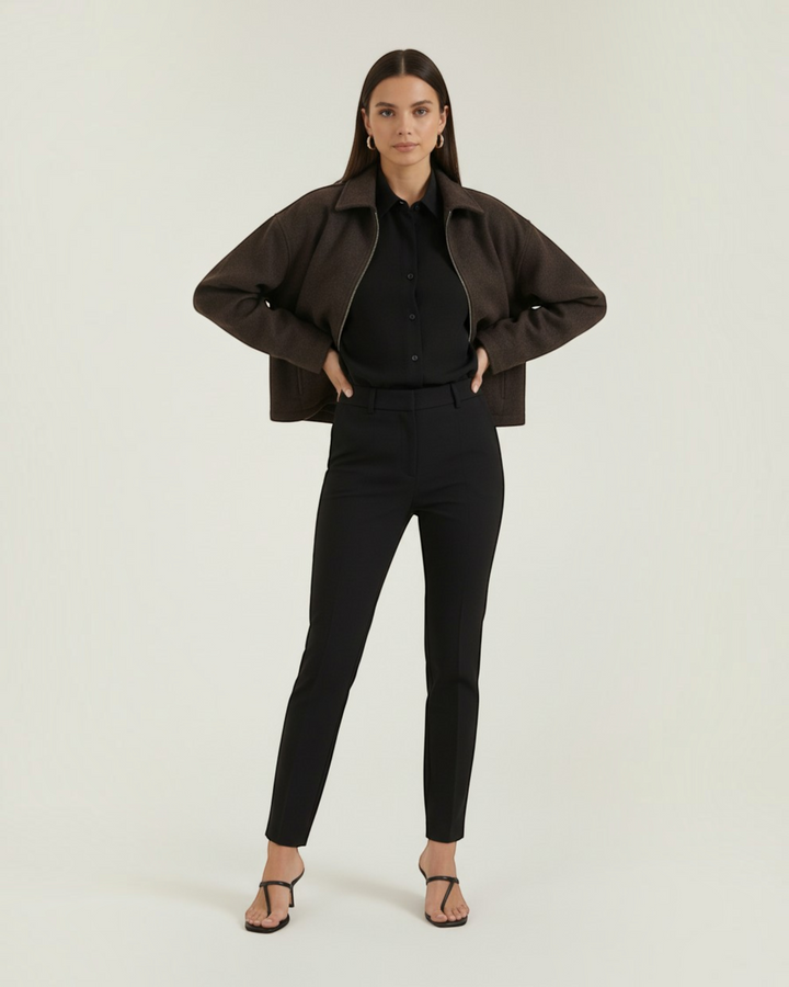 Luna Moda Teresa brown zip-up jacket with a relaxed fit worn over a black shirt and trousers by a female model.