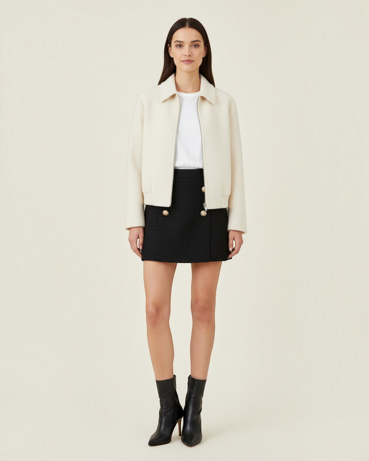 Luna Moda Teresa cream zip-up jacket with a relaxed fit and classic collar worn over a black skirt