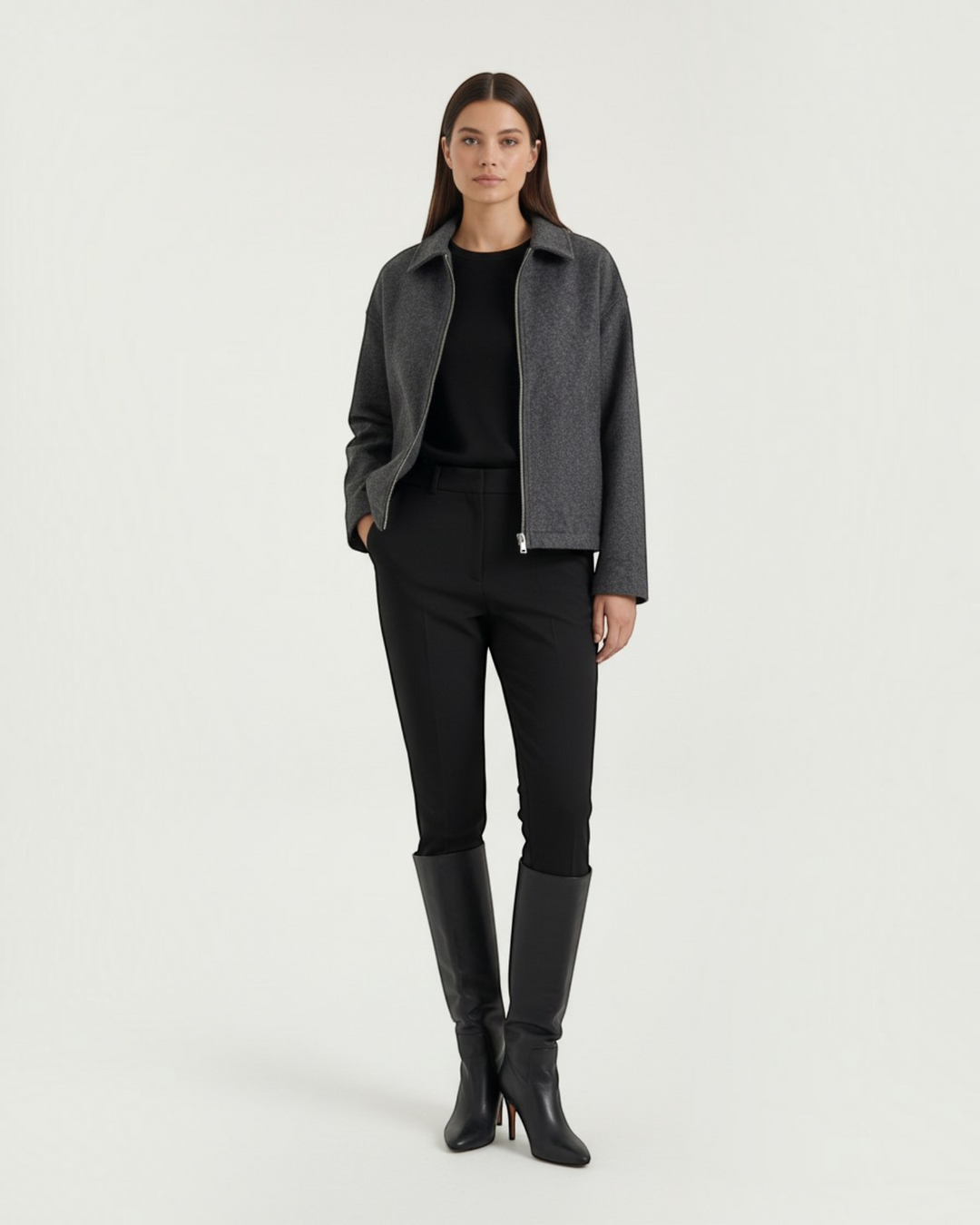 Luna Moda Teresa grey zip-up jacket with a relaxed fit, worn over a black top and trousers with knee-high boots.