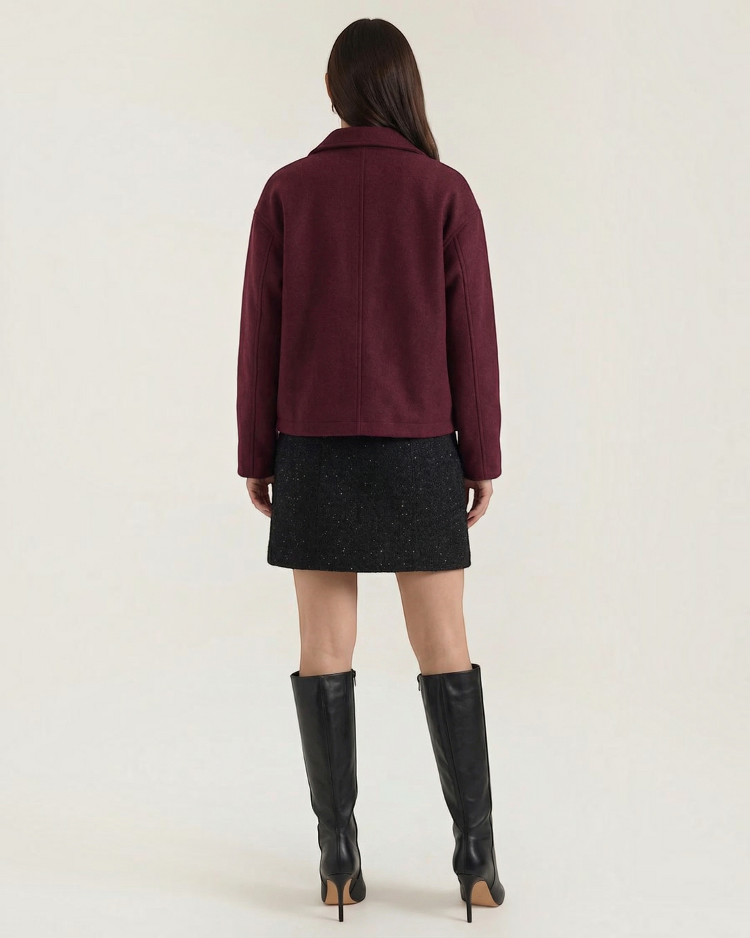 Luna Moda Teresa burgundy zip-up jacket with a relaxed fit worn by a woman with a black skirt and knee-high boots