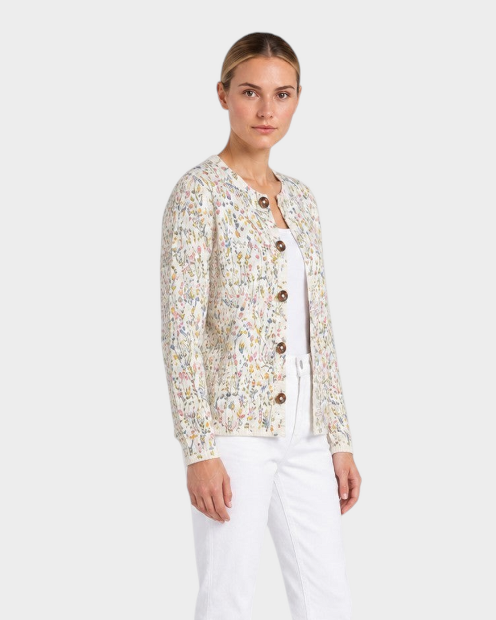 Luna Moda Veronica cardigan with cream floral print, button-front, and ribbed texture worn with white jeans.