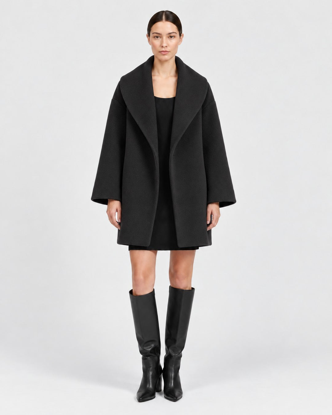 Luna Moda Veronika black tailored windbreaker jacket worn by a model with a black dress and knee-high boots