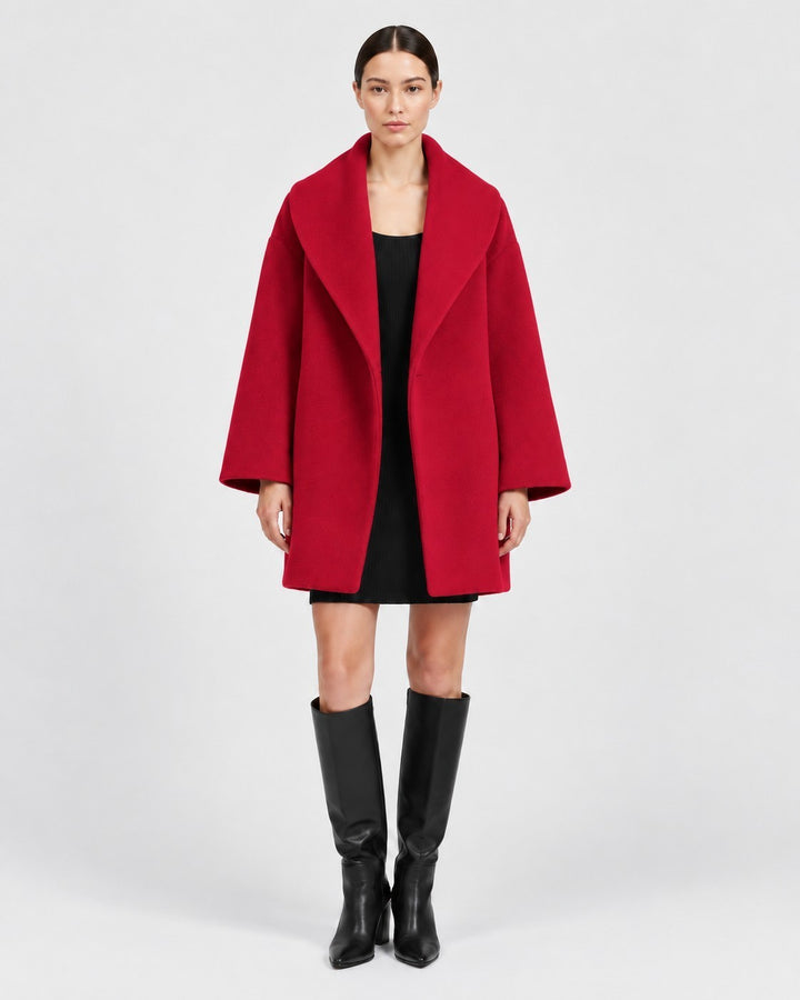 Luna Moda Veronika red wool coat with wide collar worn by a model over a black dress and knee-high boots