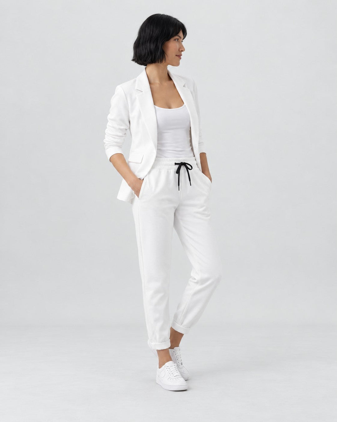 Luna Moda white Adriana blazer and elastic waist trousers set worn by a model with a white tank top and sneakers