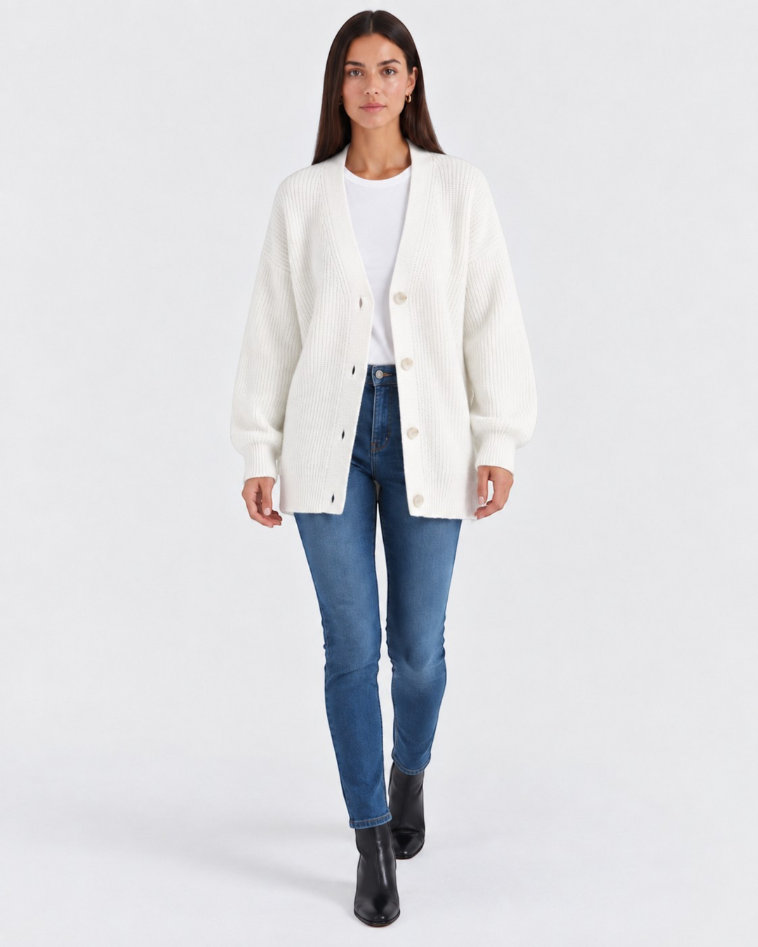 Luna Moda white cashmere V-neck cardigan worn by a model with blue jeans and black boots
