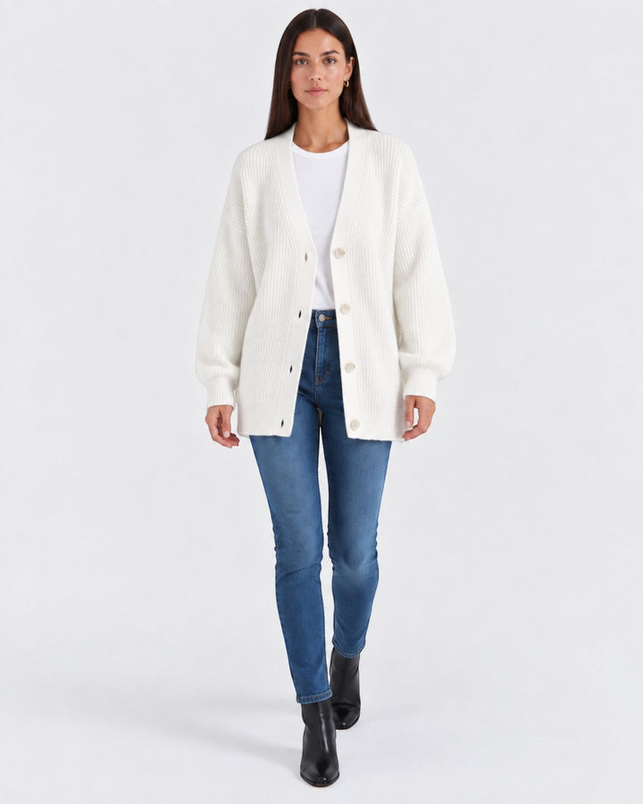 Luna Moda white cashmere V-neck cardigan worn by a model with blue jeans and black boots