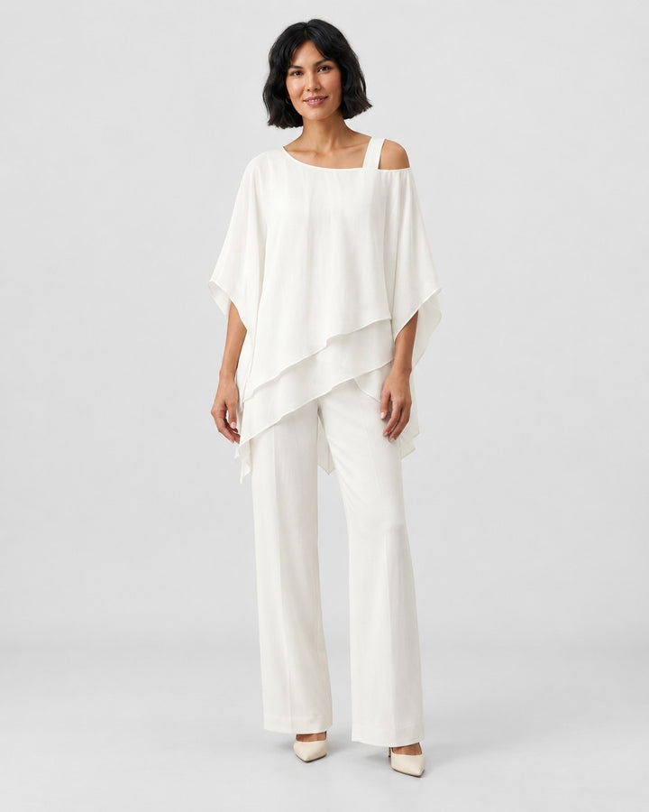 Luna Moda white chiffon two-piece set featuring a modern asymmetrical layered top and wide-leg trousers on a model.