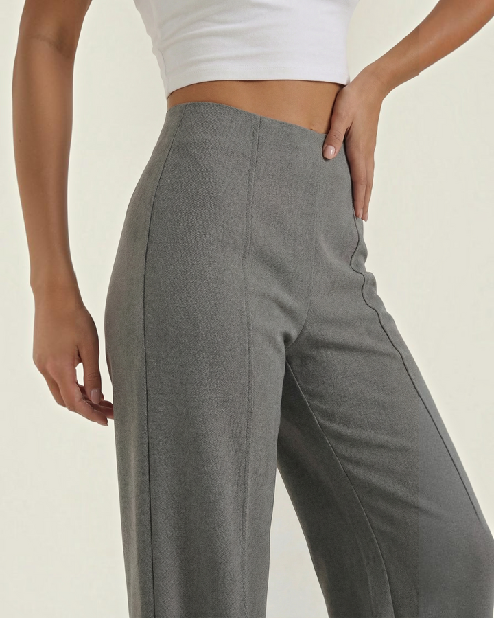 Luna Moda high-waisted grey tailored trousers with front pleats and wide-leg fit worn by a model