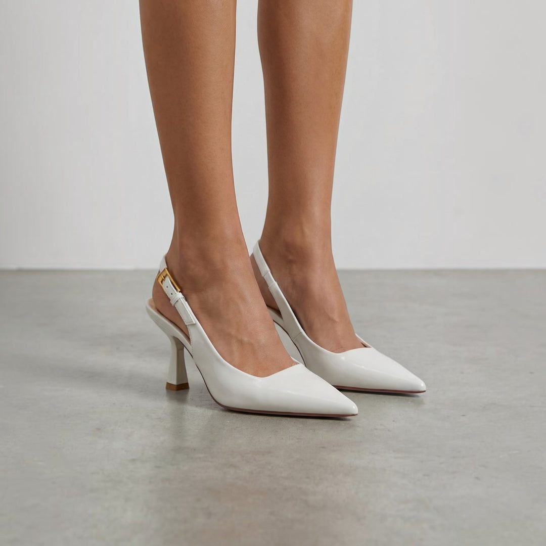 Luna Moda white patent leather slingback pumps with a 6 cm heel worn on a model against a neutral studio background