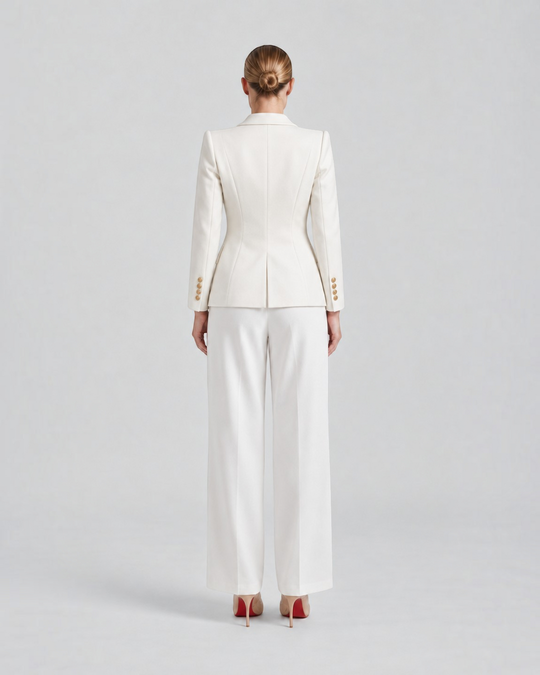 Luna Moda white structured blazer with gold decorative buttons worn by a model from the back view
