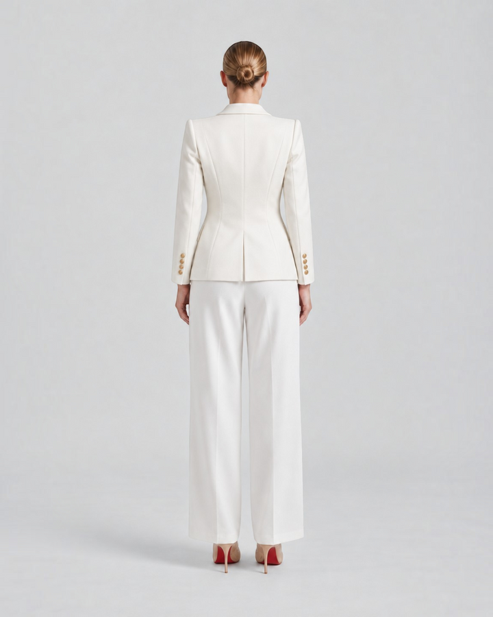 Luna Moda white structured blazer with gold decorative buttons worn by a model from the back view