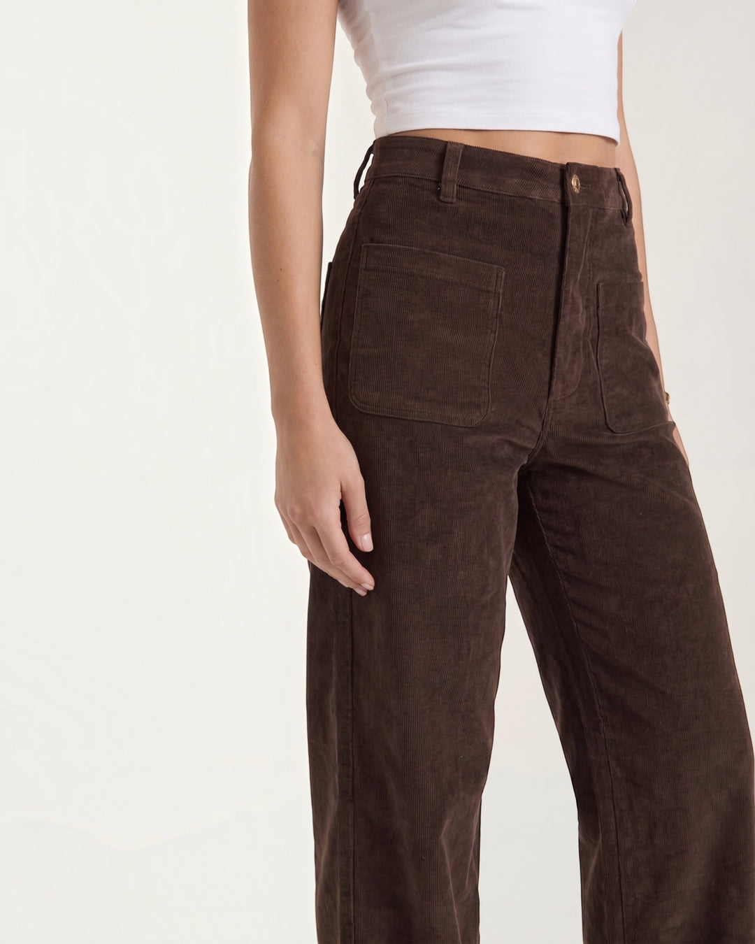 Luna Moda high-waisted wide-leg brown corduroy trousers with front pockets worn with a white crop top