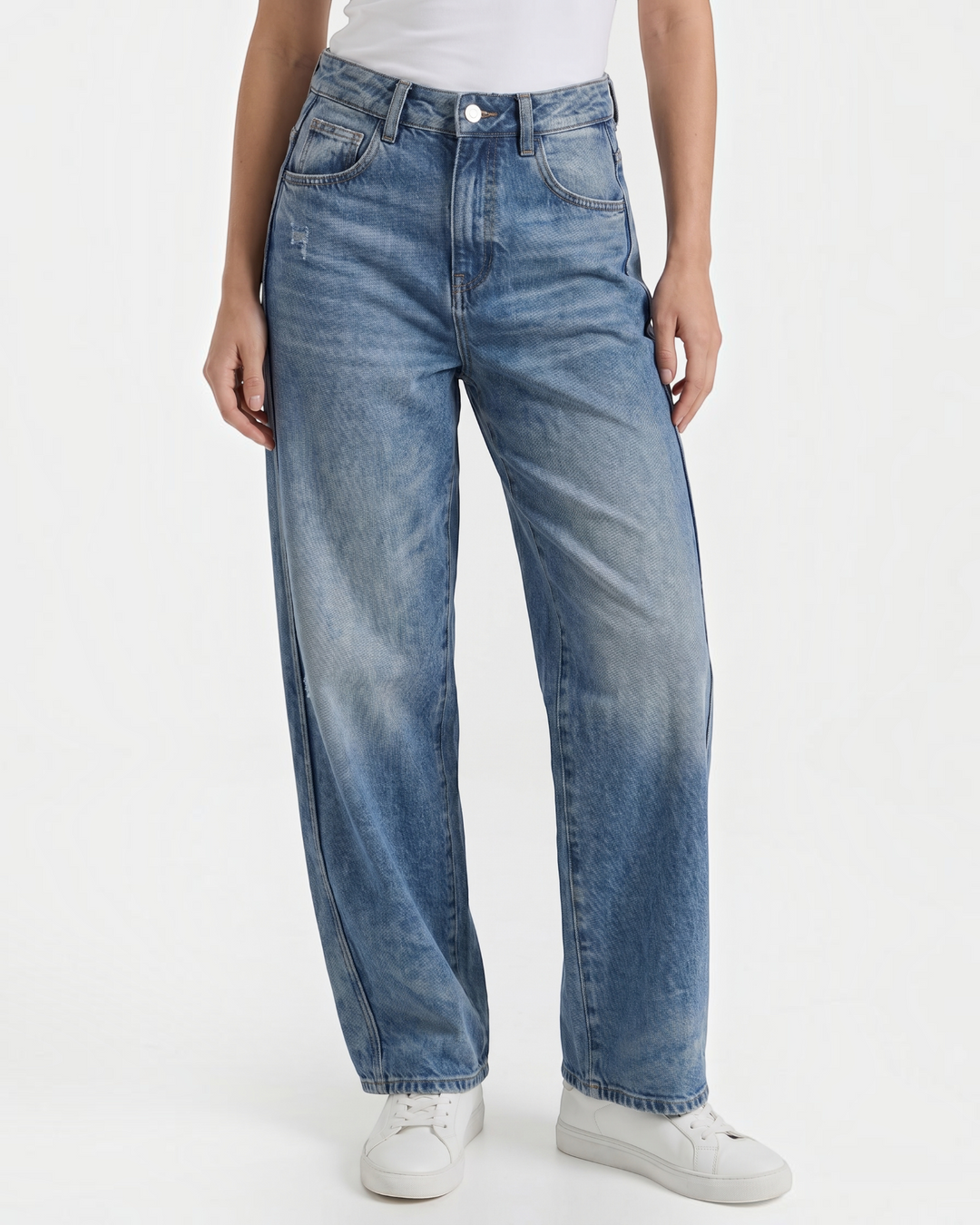 Luna Moda Bridget wide-leg jeans in soft blue denim with a relaxed fit and light wash, worn with white sneakers.