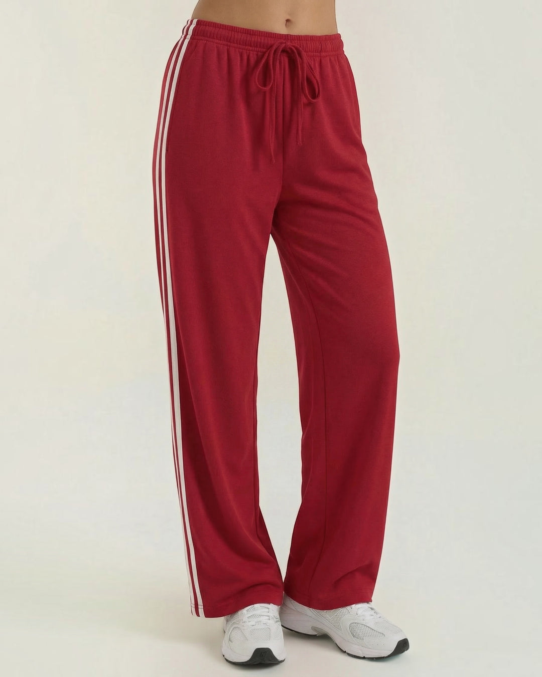 Luna Moda red wide-leg sweatpants with white side stripes and an adjustable drawstring waist for a relaxed fit.
