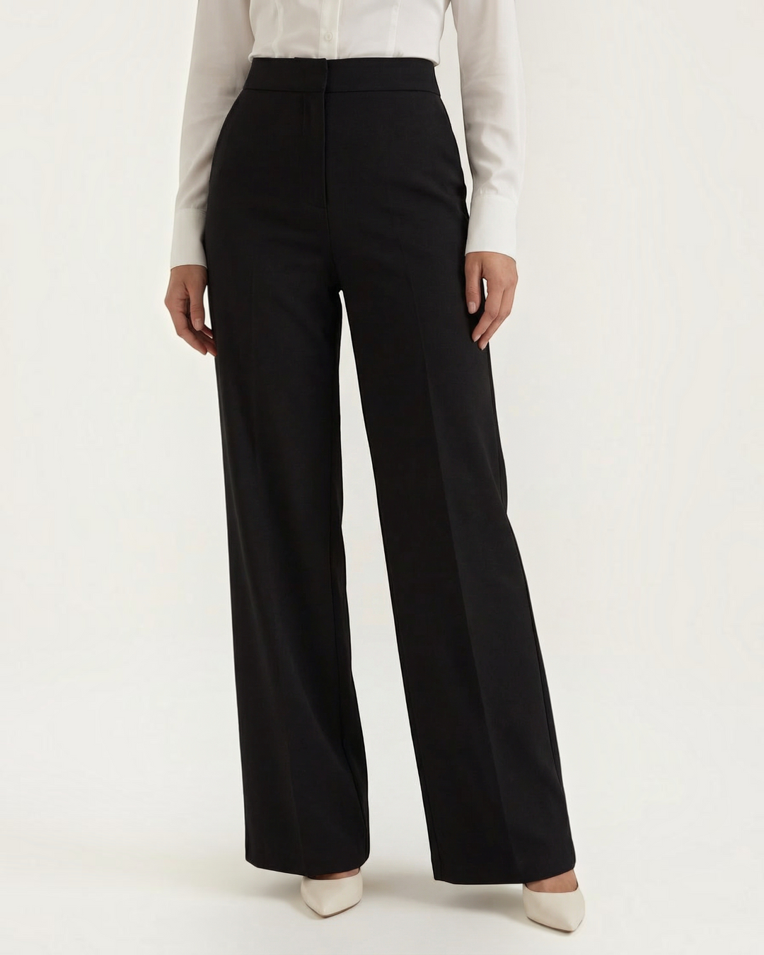 Luna Moda Stefania high-waisted wide-leg black tailored trousers with front pleats and clean architectural lines.