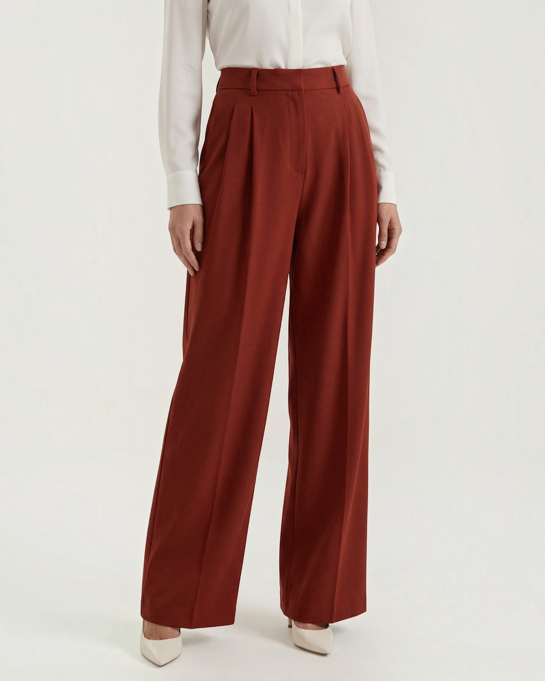 Luna Moda Stefania high-waisted wide-leg trousers in rust red with front pleats and tailored architectural fit.